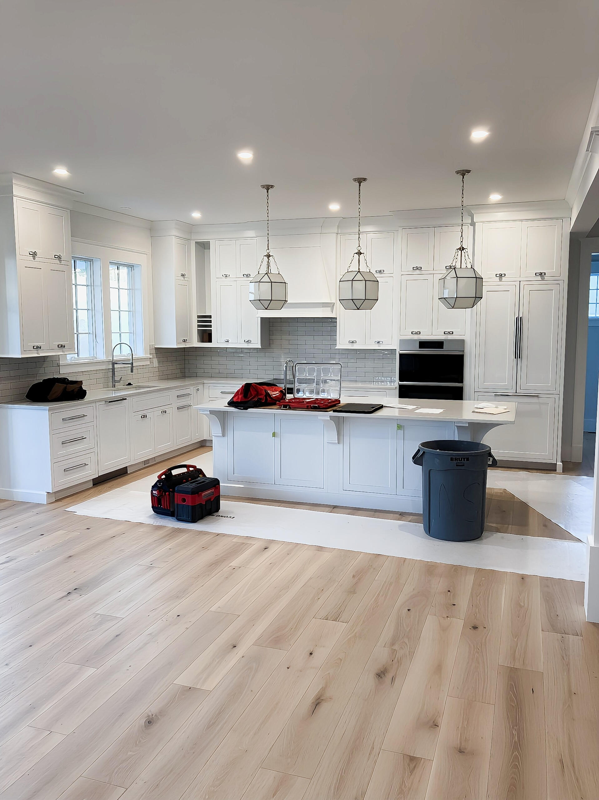 Kitchen, Lighting, Plumbing, and Flooring crafted by Home2Repair A complete kitchen renovation with maple flooring and custom lighting.