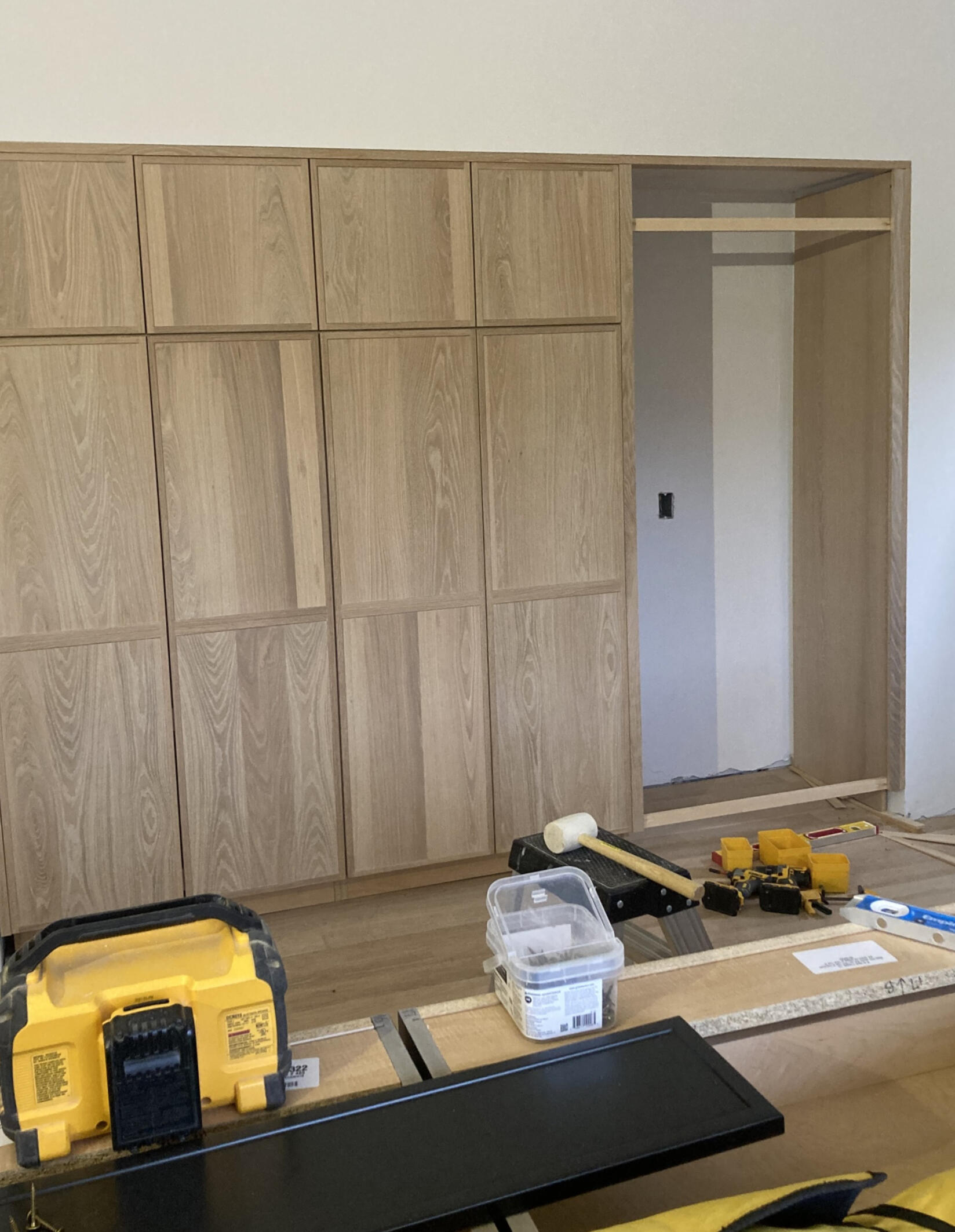 Custom oak wood amour with sliding doors. Custom oak wood amour with sliding doors.
